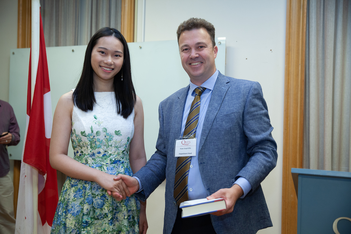 Kelsey Hoi receiving Department Medal